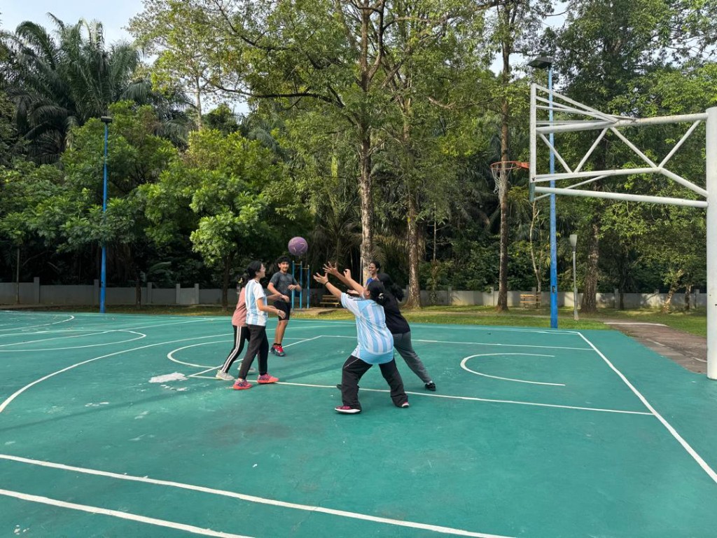Players reaching for the ball during a lively game